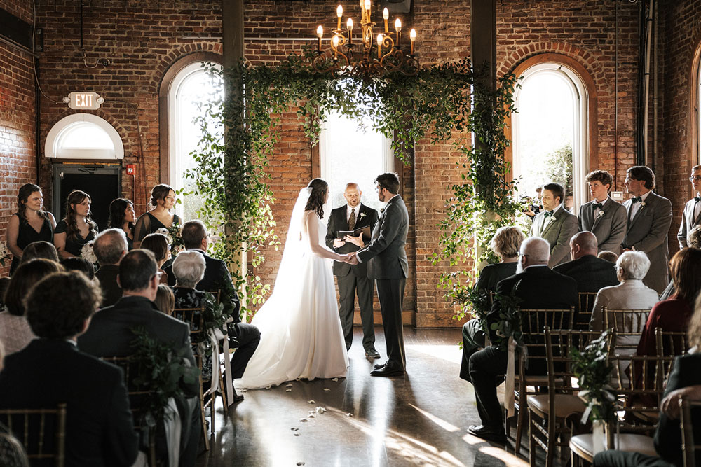 Wedding packages in chattanooga showcasing a newly married couple walking down the isle.