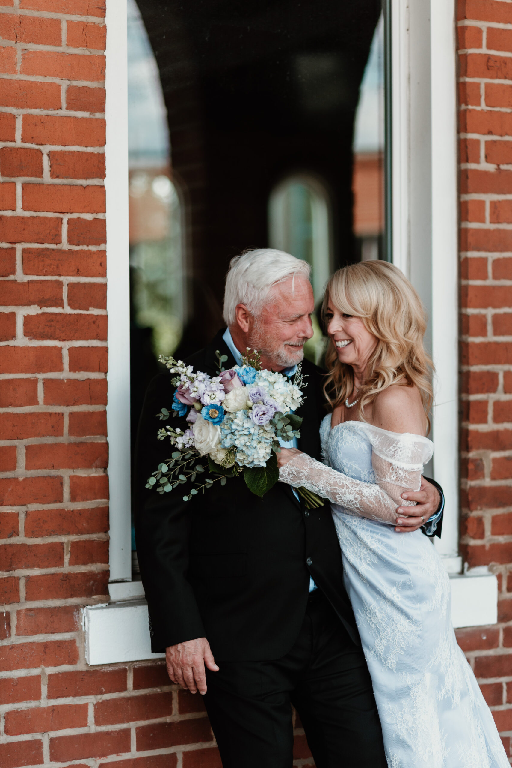 Wedding packages in chattanooga showcasing a bride and groom standing on stage preparing to be married.